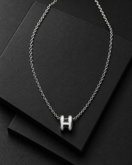 Detail view of the polished H-link pendant necklace